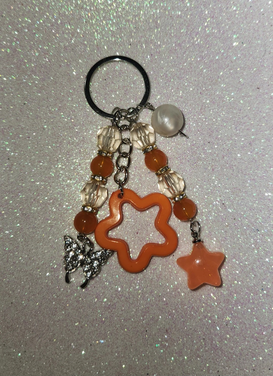 Orange star keychain w butterfly
